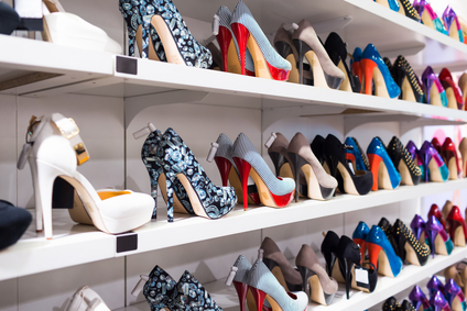Background with shoes on shelves of shop